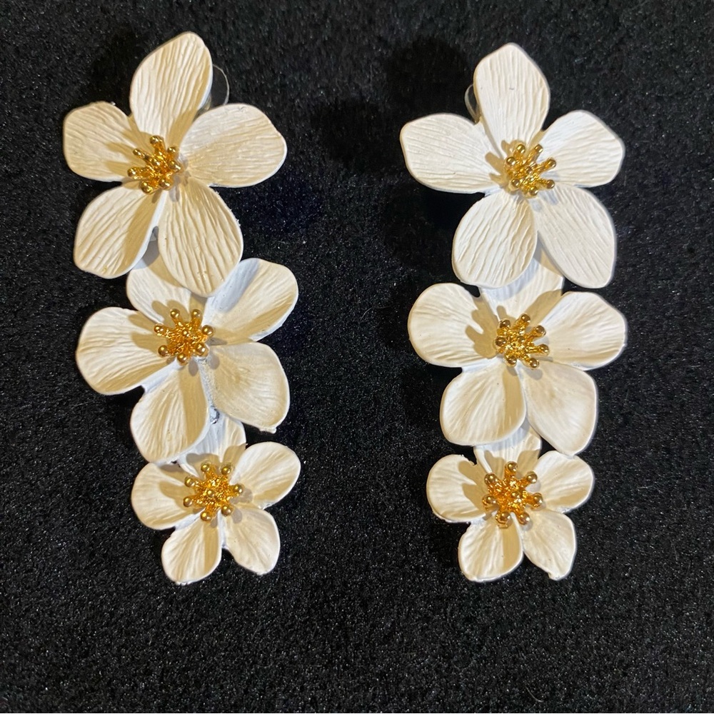 Shashi Botanique styled earrings in white with bright gold center, 3” long